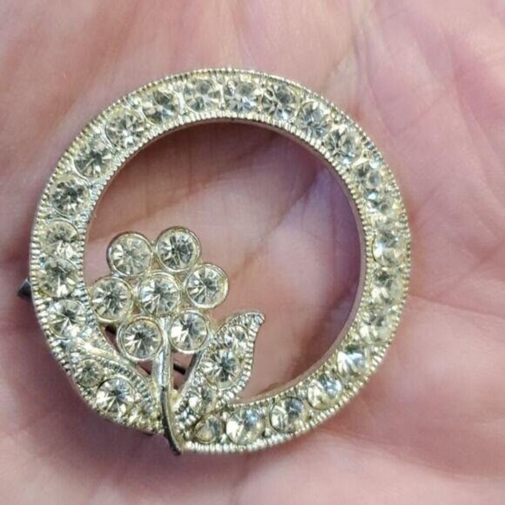 Vintage AJC round silver tone brooch